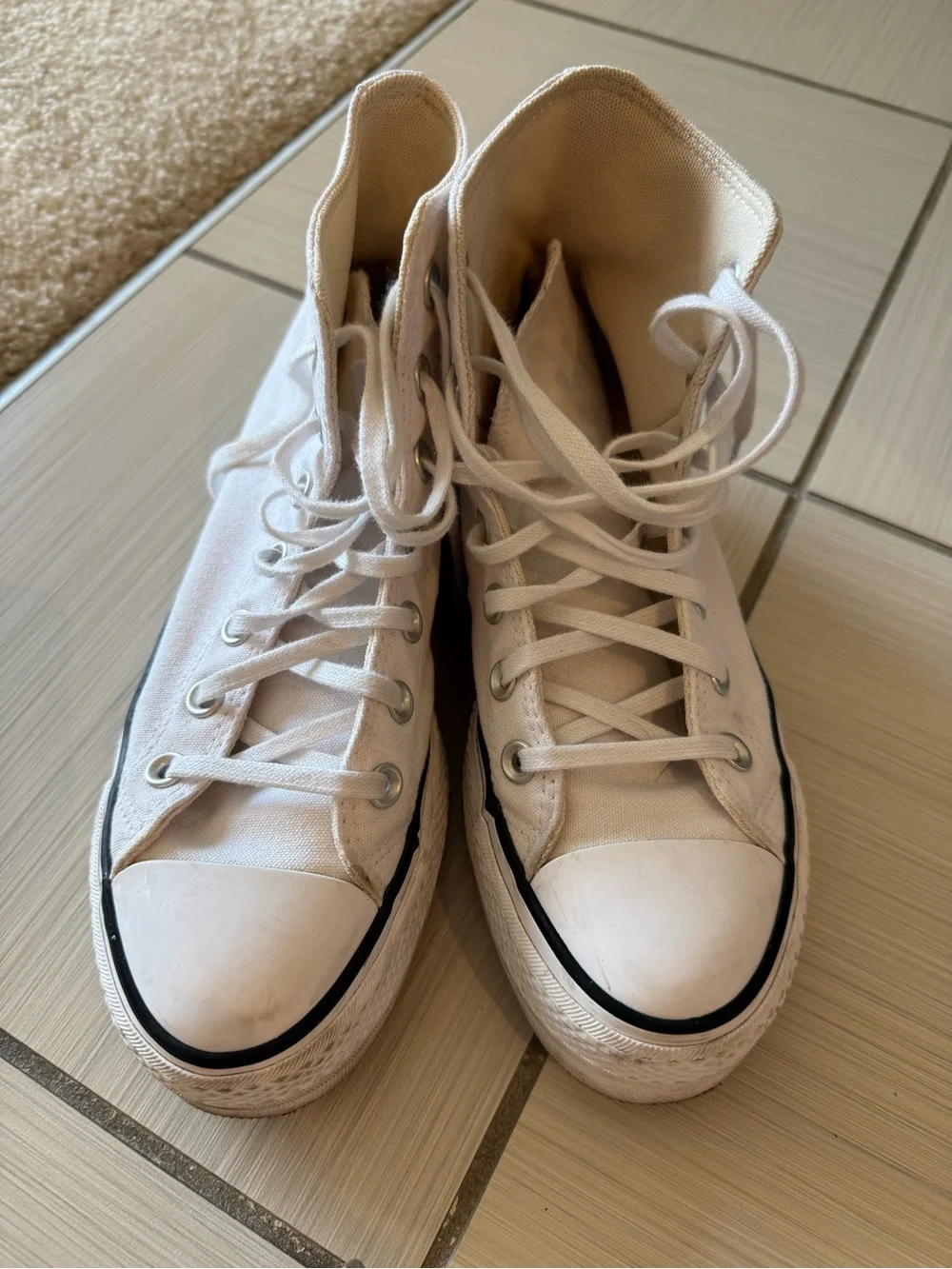 Converse Chuck Taylor’s White High Top Platform Sneakers